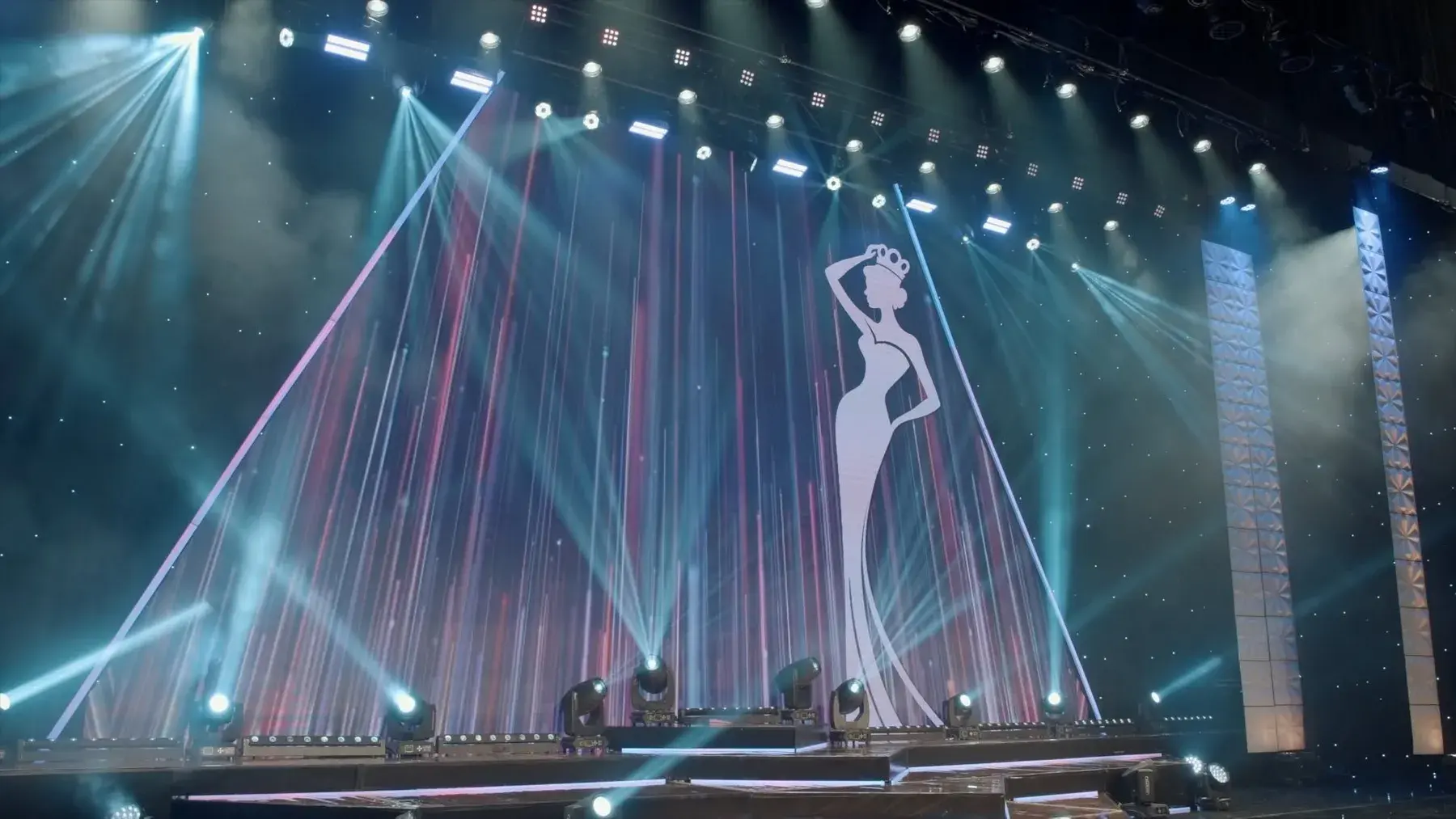 Crowned silhouette on a pageant stage surrounded by beams of light